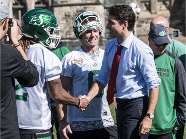 The Saskatchewan Roughriders practiced on Parliament Hill in Ottawa on Tuesday October 11, 2016. Prime Minister Justin Trudeau dropped by to meet the team. Errol McGihon/Postmedia ORG XMIT: POS1610111501371892