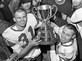 Hugh Campbell, left, and Ron Lancaster with the Grey Cup on Nov. 26, 1966 — 50 years ago on Saturday.