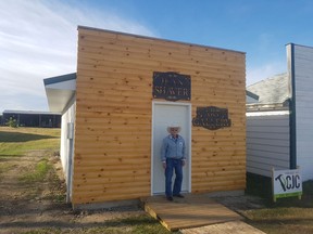 Archie Shaver stands in front of the gallery of his mother, Jean's artwork at the Deep South Pioneer Museum in Ogema. PHOTO SUBMITTED