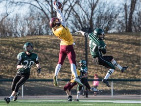 LeBoldus Golden Suns receiver Dom Dheilly soars to grab a pass for a touchdown against the Saskatoon Holy Cross Crusaders during the SHSAA 4A 12-man football final in Saskatoon on Saturday.