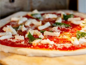 Pizza ready for the oven at Famoso Neapolitan Pizzeria in Regina. Famoso will open another two locations in Regina this fall and early 2017.