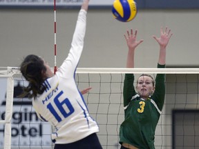 University of Regina Cougars outside hitter Leah Sywanyk (3) attempts a block during Saturday's match against the UBC Okanagan Heat at the Centre for Kinesiology, Health and Sport.