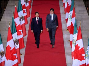 Prime Minister Justin Trudeau and Mexican President Enrique Pena Nieto walk down the Hall of Honour on their way to a signing ceremony on Parliament Hill in Ottawa in  June. Canada and Mexico delivered similar messages last week about being willing to engage U.S. president-elect Donald Trump in discussing amendments to the North American Free Trade Agreement.
