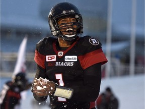 Ottawa Redblacks quarterback Henry Burris makes a snowball as he celebrates a Kienan LaFrance touchdown against the visiting Edmonton Eskimos in the CFL's East Division final Sunday.