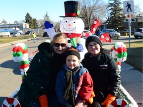 Joann Weslowski, Ethan Demorest, and Austin McStay at the Santa Claus Parade held on south Albert Street in Regina on Nov. 20.