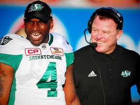 Columnist Rob Vanstone expects that Saskatchewan Roughriders quarterback Darian Durant, left, and head coach/GM Chris Jones, right, will be all smiles once a contractual impasse is resolved.