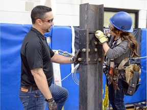 Arcola School grade 7 student Ghoufran Daghmoush listens to iron worker Wayne Worrall on how to preform a column splice at Regina Public Campus in Regina.  It was part of Try-a-trade where grade 7 and 8 students will get the opportunity to try their hand at different skills that may leader to careers for them.