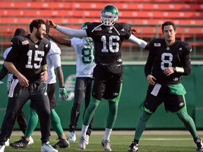 G.J. Kinne, left, Brandon Bridge, centre, and Mitchell Gale, right, all played quarterback for the Saskatchewan Roughriders in their regular-season finale.