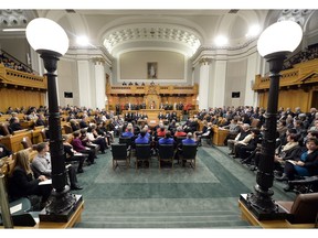 Saskatchewan MLAs and guests listen to the throne speech in the legislature on Oct. 23, 2014.