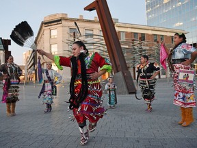 Jordynn Delorme (C) dances with her mother Chasity Delorme (L) and her sisters and friends during the Nipiy Ohci "For Our Water" Community Healing and prayer event to send prayers to the water protectors in Standing Rock, ND and also to pray for the environment and water here in the province. The event took place at the City Square Plaza in downtown Regina.