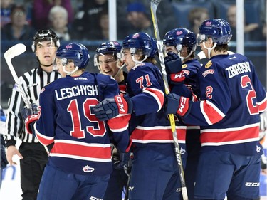 Members of the Regina Pats congratulate Jake Leschyshyn after scoring on the Saskatoon Blades during a Western Hockey League game against the Saskatoon Blades at the Brandt Centre in Regina.