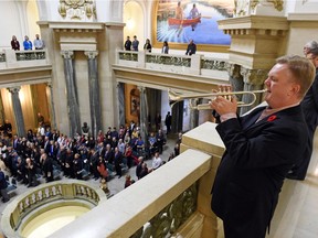 Miles Newman plays reveille on the trumpet during the annual Service of Remembrance for the Public Service in the Rotunda of the Legislative Building in Regina.
