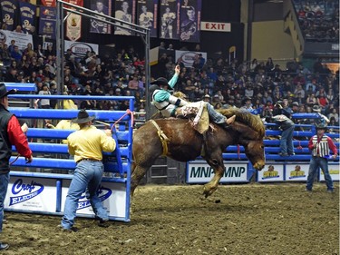 Pascal Isabelle from Okotoks, AB riding Show Boy during the bareback event at the Agribition Pro Rodeo at the Canadian Western Agribition in Regina.