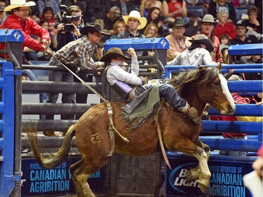 Wyatt Maines from Maple Creek, SK riding Hot Moccasin during the bareback event at the Agribition Pro Rodeo at the Canadian Western Agribition in Regina.