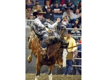 Wyatt Maines from Maple Creek, SK riding Hot Moccasin during the bareback event at the Agribition Pro Rodeo at the Canadian Western Agribition in Regina.