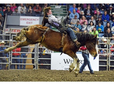 Wyatt Maines from Maple Creek, SK riding Hot Moccasin during the bareback event at the Agribition Pro Rodeo at the Canadian Western Agribition in Regina.