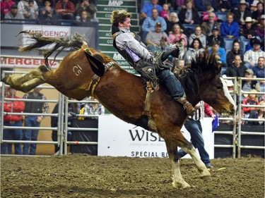 Wyatt Maines from Maple Creek, SK riding Hot Moccasin during the bareback event at the Agribition Pro Rodeo at the Canadian Western Agribition in Regina.