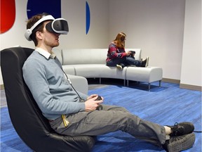 Brad Louttit tries out the Playstation VR at the rebuilt George Bothwell branch public library in Regina's Southland Mall.