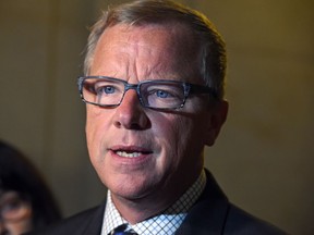 Premier Brad Wall and his government are challenged by low oil prices and rising unemployment.