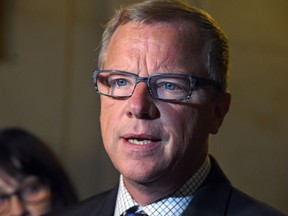 Premier Brad Wall's government is being pressured to provide more answers on the controversial Global Transportation Hub land deal.