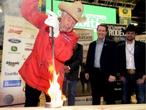 John Willmott, who has been a part of Agribition for more than four decades, performs the ceremonial "burning of the brand," marking the official opening of the 46th edition of Canadian Western Agribition. Attracting about 400 exhibitors and 130,000 visitors, Agribition is recognized as Canada's premier livestock showcase and "the best beef show in North America."