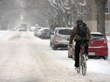 This cyclist didn't let the snow get in his way on his way to work.