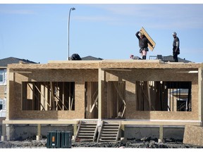 Crews work on homes in Harbour Landing. Regina saw a surge in housing construction in October, with 147 housing starts posted last month, up from 94 in October 2015, Canada Mortgage and Housing Corp. (CMHC) said this week.