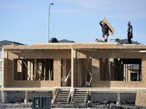 Crews work on semi-detached homes in Harbour Landing earlier this month. CMHC says rental vacancy rates increased slightly to 5.5 per cent in October due to the supply of  rental units exceeding demand.