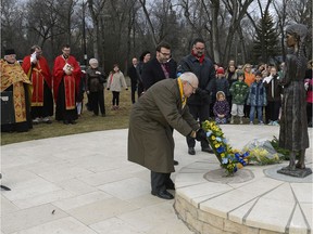 Wreaths are laid at the Holodomor statue in Wascana Centre after the annual Holodomor (or Ukrainian famine-genocide) commemoration ceremony at the nearby  Saskatchewan Legislative Building.