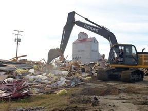 A track hoe knocks down the set of Corner Gas in Rouleau.