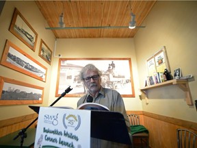 Saskatchewan author Bruce Rice reads a passage from his book at the launch of a "writers corner" at Bushwakker Brewpub in Regina, Sask. on Saturday Nov. 12, 2016. The corner will begin as one shelf, right, of Saskatchewan authors and over time grow into a library of the province's wordsmiths.