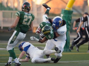 University of Regina Rams defensive back Kahlen Branning (5) gets tackled by UBC Thunderbirds offensive lineman Dakoda Shepley (64) on a missed field-goal return during Saturday's Canda West football semifinal at Mosaic Stadium.