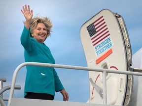 Democratic presidential nominee Hillary Clinton boards her plane at Philadelphia International Airport November 6, 2016 in Philadelphia, Pennsylvania. Donald Trump barnstorms five states Sunday while Hillary Clinton implores her most fervent supporters to get to the polls, in a frenetic final 48-hour dash to the US presidential election. /