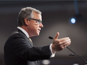 Saskatchewan Premier Brad Wall gestures during a speech on climate change to the Regina Chamber of Commerce at the Conexus Arts Centre in Regina, Saskatchewan on Tuesday October 18, 2016. Wall spoke about his concerns about the Trudeau government's national carbon tax plan.