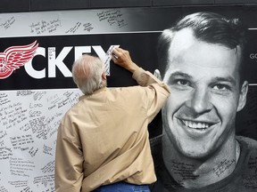 A fan leaves a tribute to Gordie Howe outside Joe Louis Arena in Detroit after Mr. Hockey's death in June.