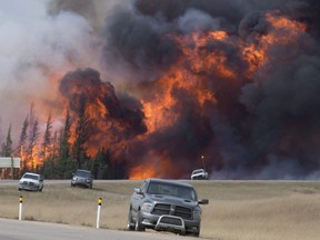 A giant fireball is seen as a wild fire rips through the forest 16 km south of Fort McMurray, Alberta on highway 63 on May 7, 2016.