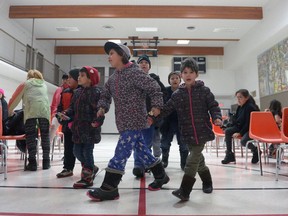 Children find a place to sit at a City Kidz Regina event held at Zeke's Place in Regina, Sask. on Saturday Dec. 3, 2016. City Kidz is Christian organization that works with kids in low-income communities.