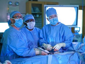 Dr. Gavin Beck, surgical assistant, and Dr. Yigang Luo (left to right) during kidney transplant surgery at St. Paul's Hospital Saskatoon.