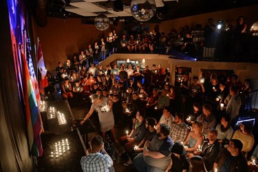 In response to the gay night club massacre in Orlando, Florida, members and supporters of the LGBT community filled Q Nightclub and Lounge during a candlelight vigil to honour the dead and comfort one another in Regina, Sask. on Sunday June. 12, 2016.