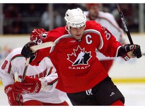 Eric Lindros, shown playing for Canada at the 1998 Winter Olympics, also wore the Maple Leaf at the 1991 world junior hockey championship in Saskatchewan.