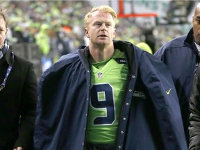 Seattle Seahawks punter Jon Ryan leaves the game after suffering a concussion against the Los Angeles Rams on Thursday.