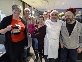 Maria Hendrika, executive director of the Regina Transition House, left, stands with Kevin Foley, Bailey Kreutzer, Kelly Lima, Perry Makris, Nick Makris and Art Lima during last year's Coffee Day at Nicky's.