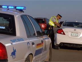 RCMP Const. Todd Kaufmann, with Regina Regina Traffic Services, makes a traffic stop on the Trans-Canada Highway east of the city.
