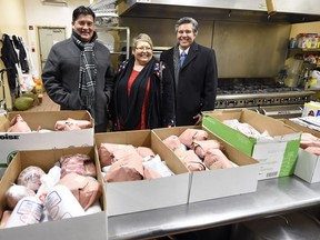 Federation of Sovereign Indigenous Nations Chief Bobby Cameron, left, FSIN Vice Chief Heather Bear and First Nations University President Mark Dockstator deliver wild meat to Souls Harbour in Regina.