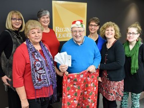 Jim Toth of the Leader-Post Foundation (centre) was all smiles as he presented initial payments to representatives of each of the four women's shelters supported by the Leader-Post Christmas Cheer Fund in 2015. Pictured with Toth, left to right, are Leader-Post lifestyles co-ordinator Irene Seiberling, Margaret Crowe of WISH Safe House, Maria Hendrika of Regina Transition House, Carol Yoner of the YWCA Regina's Isabel Johnson Shelter, Sarah Valli of SOFIA House and Janet Tzupa of the YWCA Regina's Isabel Johnson Shelter.