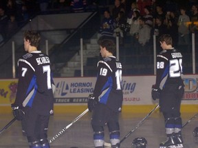 Members of the Swift Current Broncos stand for a moment of silence at the Brandt Centre 25 years after a bus crash claimed four Broncos players — Trent Kresse, Scott Kruger, Chris Mantyka and Brent Ruff.