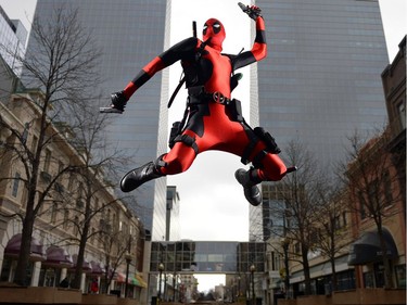 Wade Schnell, local Regina resident dressed up as Deadpool, poses at a number of local spots in Regina on Friday.