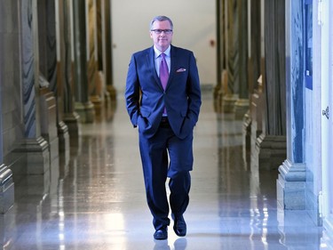 Saskatchewan Premier Brad Wall walking back to his office at the legislative building after a scrum regarding the possibility of a $1-billion stimulus package from the federal government for Alberta and Saskatchewan.