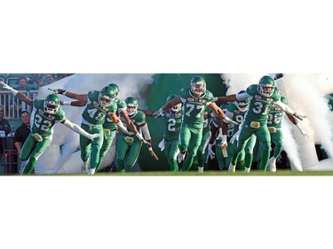 The Saskatchewan Roughriders enter Taylor Field during CFL action against the Ottawa Redblacks at Mosaic Stadium in Regina.