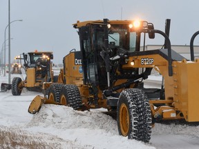 City graders on Ross Avenue at Roulston Street make short work of the snow on Tuesday.